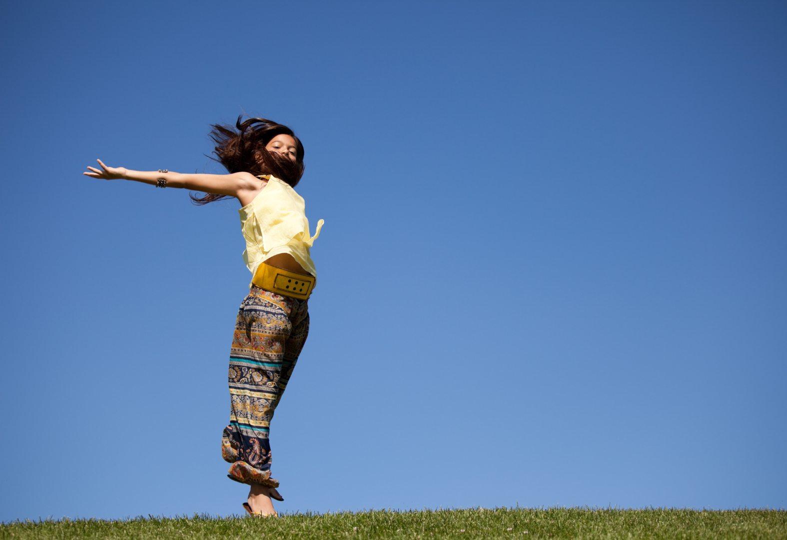 Woman dancing in field